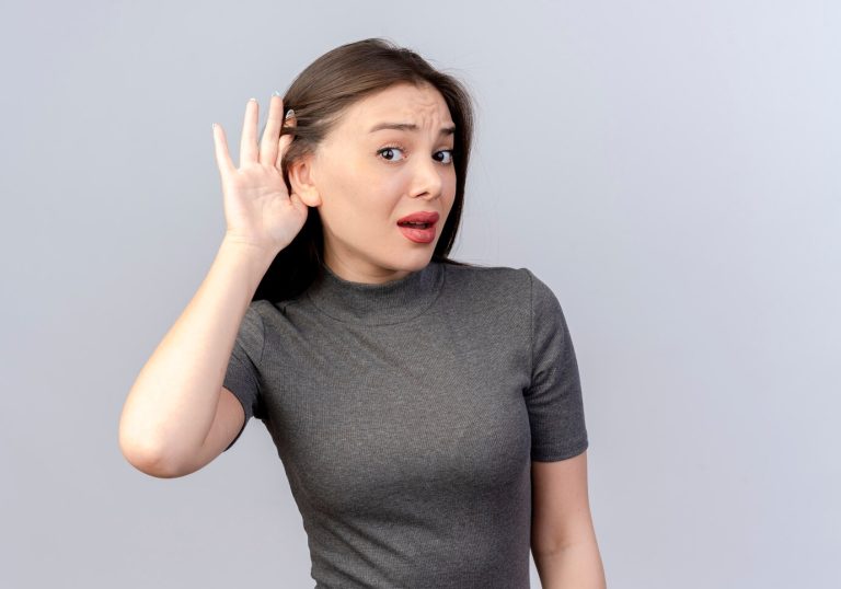 curious-young-pretty-woman-doing-can-t-hear-you-gesture-camera-isolated-white-background-with-copy-space_141793-32141